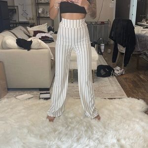 White pants with black pin stripes